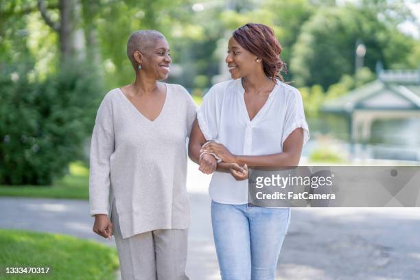 bonding with mother who has cancer - prop stock pictures, royalty-free photos & images