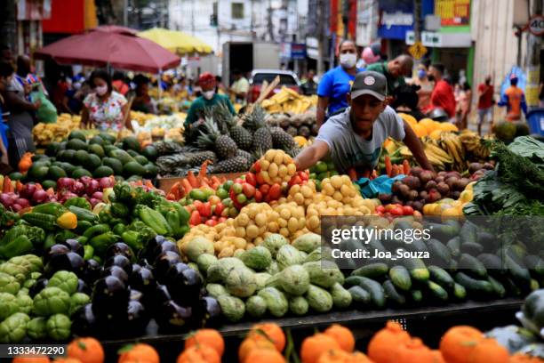 fruit and vegetable seller in salvador - tropical fruit stock pictures, royalty-free photos & images
