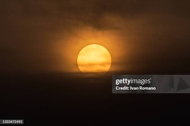 The sun sets on August 10, 2021 in Salerno, Italy. The influence of the African subtropical anticyclone Lucifer continues in Italy, making this week...