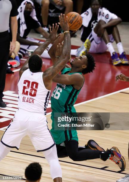 Aaron Nesmith of the Boston Celtics shoots against Tarik Black of the Denver Nuggets during the 2021 NBA Summer League at the Thomas & Mack Center on...