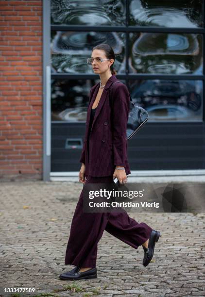 Jacqueline Zelwis is seen wearing bordeaux wide leg pants, blazer outside Gestuz on August 10, 2021 in Copenhagen, Denmark.