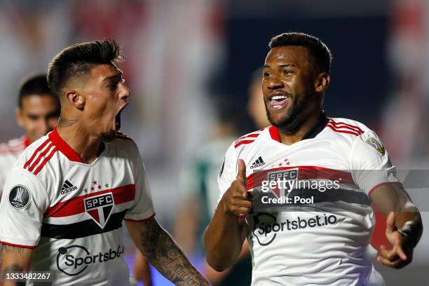 Luan Santos of Sao Paulo celebrates with teammate Emiliano Rigoni after scoring the first goal of his team during a quarter final first leg match...