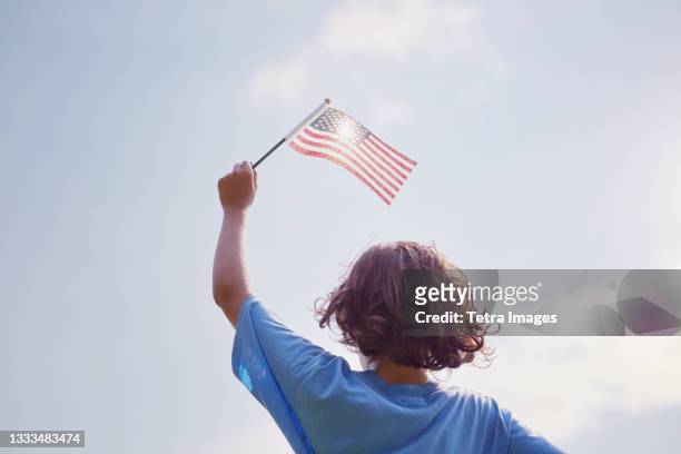 boy waving american flag - brown hair waves stock pictures, royalty-free photos & images
