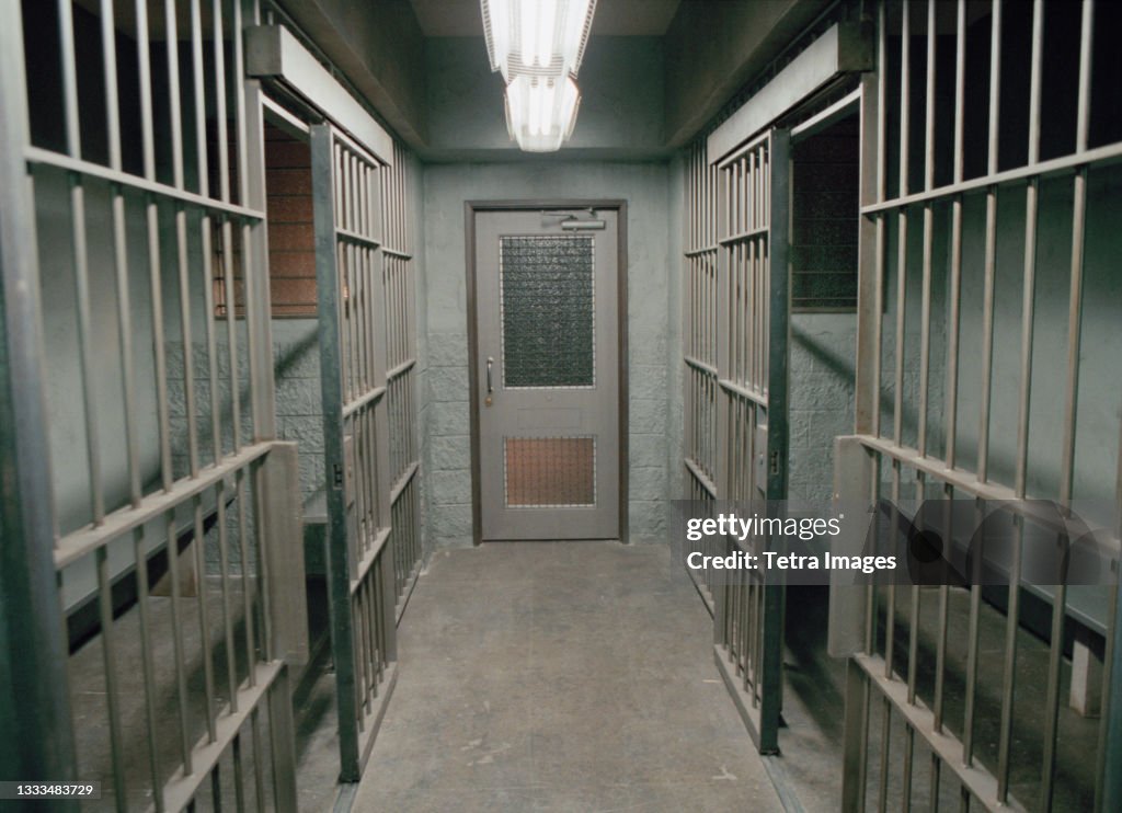 Row of empty prison cells