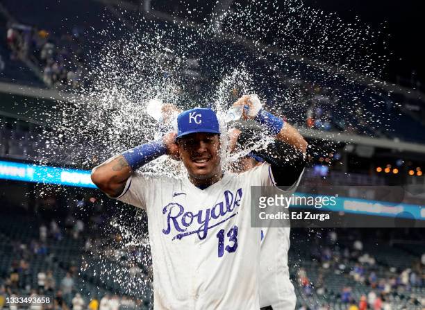 Salvador Perez of the Kansas City Royals is doused with water by Nicky Lopez as they celebrate an 8-4 win over the New York Yankees at Kauffman...