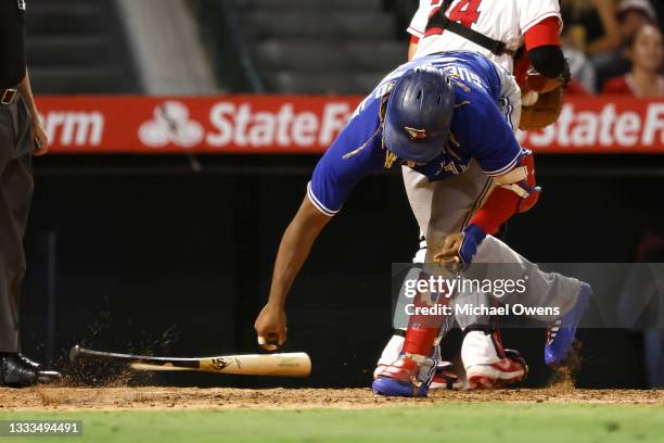 Vladimir Guerrero Jr. #27 of the Toronto Blue Jays slams his bat after striking out against Jose Suarez of the Los Angeles Angels during the fifth...