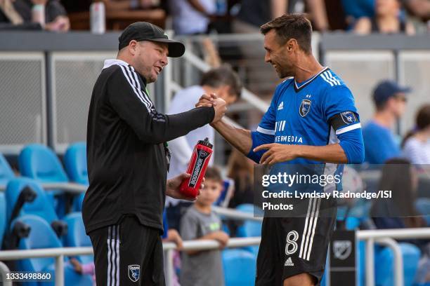 Chris Wondolowski of the San Jose Earthquakes greets a staff member before a game between San Jose Earthquakes and Houston Dynamo at PayPal Park on...