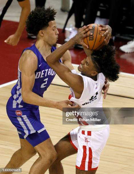 Jalen Green of the Houston Rockets drives against Cade Cunningham of the Detroit Pistons during the 2021 NBA Summer League at the Thomas & Mack...