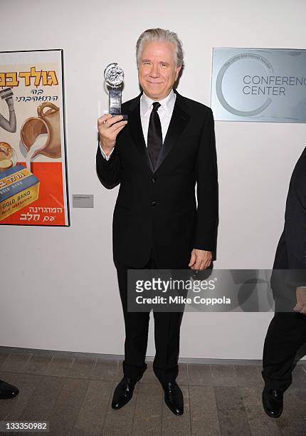 John Larroquette poses with the award for Best Performance by an Actor in a Featured Role in a Musical during the 65th Annual Tony Awards at the The...