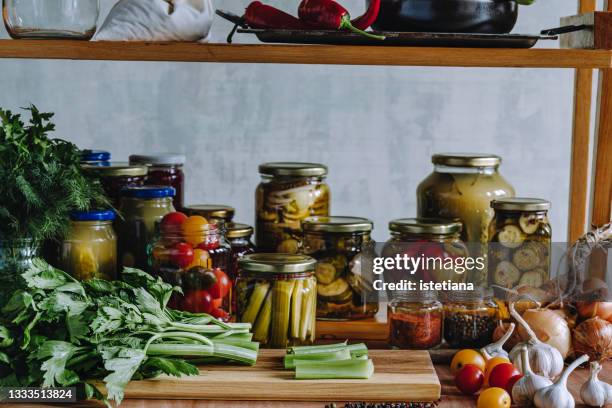 kitchen pantry. making fermented pickled celery, fresh vegetables - pickle jar stock pictures, royalty-free photos & images