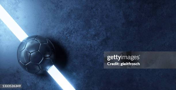 Blue futsal ball on the line of a futuristic indoor soccer field with plenty of copy space background