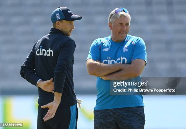 Joe Root and Chris Silverwood of England talk during a training session before Thursday's 2nd Test match between England and India at Lord's Cricket...