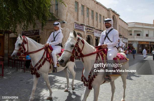 qatar's mounted police in doha. - bereden politie stockfoto's en -beelden