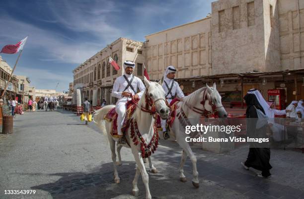 qatar's mounted police in doha. - bereden politie stockfoto's en -beelden