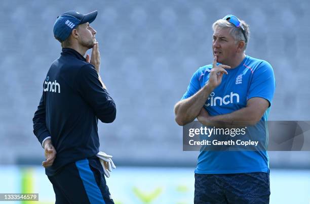 England captain Joe Root speaks coach Chris Silverwood during a nets session at Lord's Cricket Ground on August 11, 2021 in London, England.