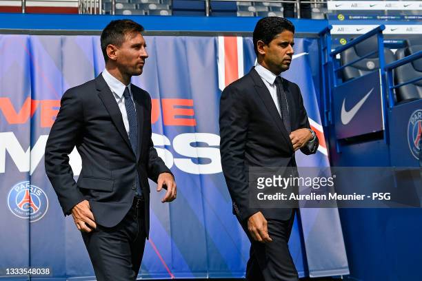 Lionel Messi arrives with President Nasser Al Khelaifi after the press conference of Paris Saint-Germain at Parc des Princes on August 11, 2021 in...