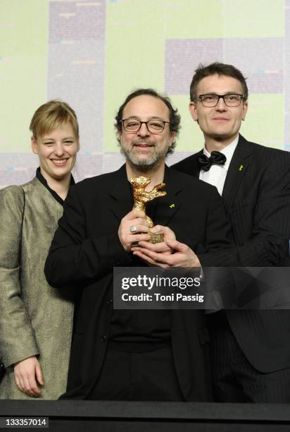 Co-producer Bettina Brokemper, director Semih Kaplanoglu and co-producer Johannes Rexin pose with the Golden Bear Award for Best Film at the 'Award...