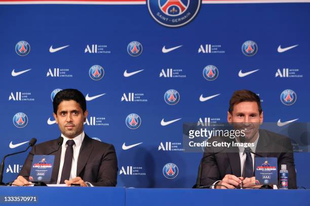 Lionel Messi answers journalists with President Nasser Al Khelaifi during a conference of Paris Saint-Germain at Parc des Princes on August 11, 2021...