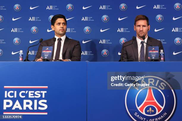 Lionel Messi answers journalists with President Nasser Al Khelaifi during a conference of Paris Saint-Germain at Parc des Princes on August 11, 2021...