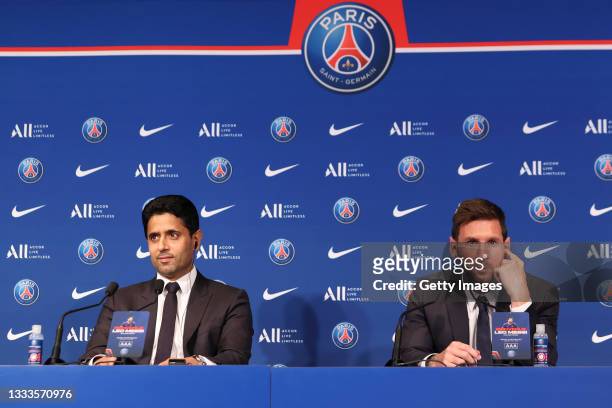 Lionel Messi answers journalists with President Nasser Al Khelaifi during a conference of Paris Saint-Germain at Parc des Princes on August 11, 2021...