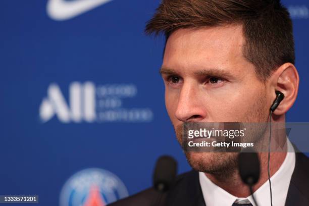 Lionel Messi answers journalists during the press conference of Paris Saint-Germain at Parc des Princes on August 11, 2021 in Paris, France.
