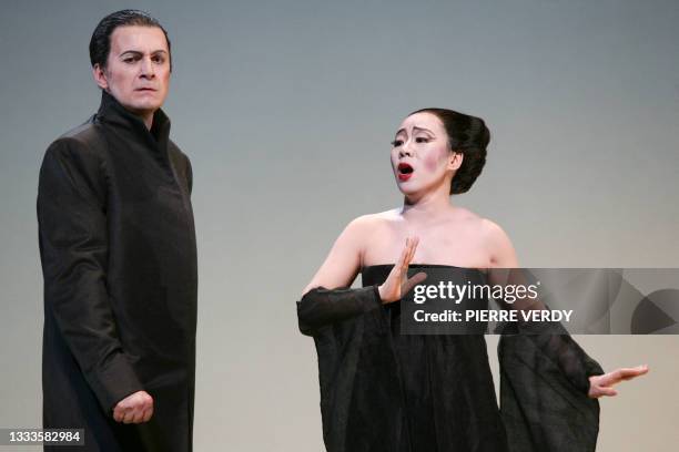 Opera chinese soprano Liping Zhang as Cio-Cio San and Dwayne Croft as Sharpless, perform 20 January 2006 on the stage of the Opera Bastille in Paris,...