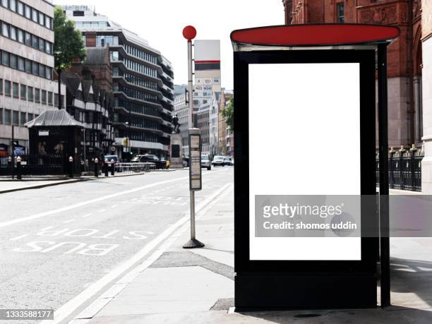 blank advertising screen on street in london - london billboard stockfoto's en -beelden