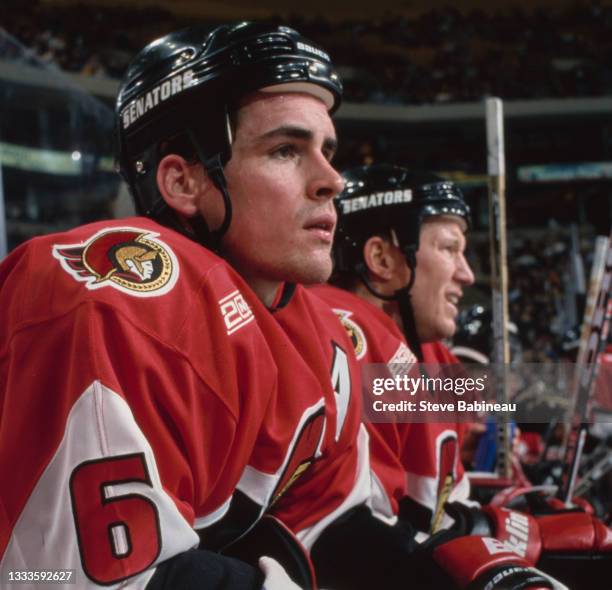 Wade Redden, Defenseman for the Ottawa Senators looks on from the bench during the NHL Eastern Conference Northeast Division game against the Boston...