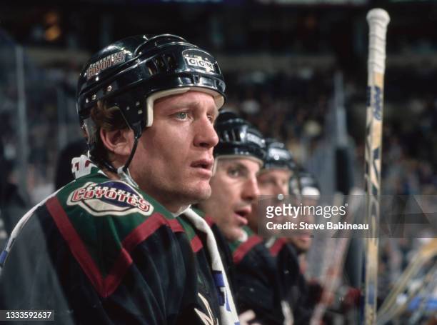 Jeremy Roenick, Center for the Phoenix Coyotes looks on from the bench during the NHL Eastern Conference Northeast Division game against the Boston...