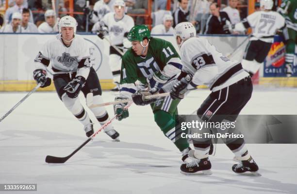Kevin Dineen, Right Wing for the Hartford Whalers in motion on the ice during the NHL Clarence Campbell Conference Smythe Division game against the...