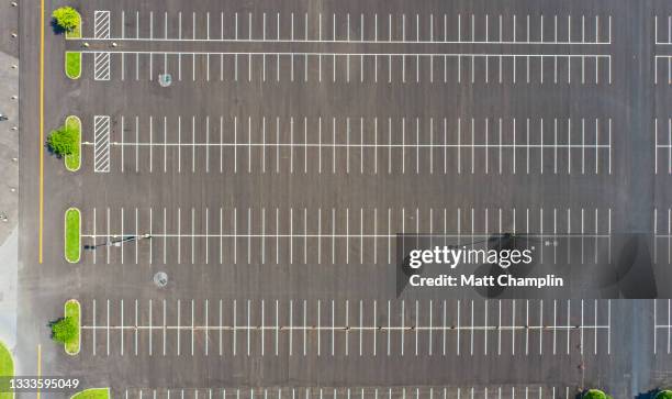 aerial of empty parking lot - parking lot stockfoto's en -beelden