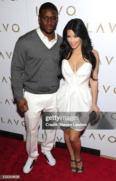 Pro football player Reggie Bush and television personality Kim Kardashian arrive for "Queen Of Hearts" ball at Lavo Restaurant & Nightclub at The...