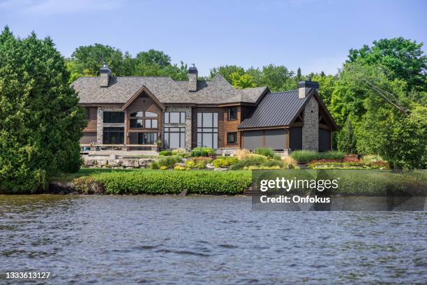 lakefront luxury property on sunny day of summer - waterfront bildbanksfoton och bilder