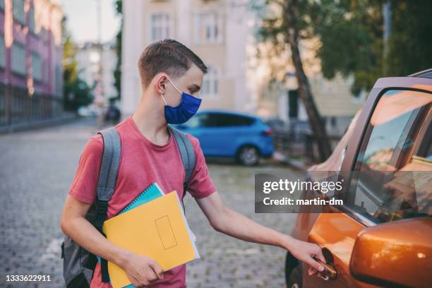 back to school during covid-19 pandemic - taxi boys stock pictures, royalty-free photos & images