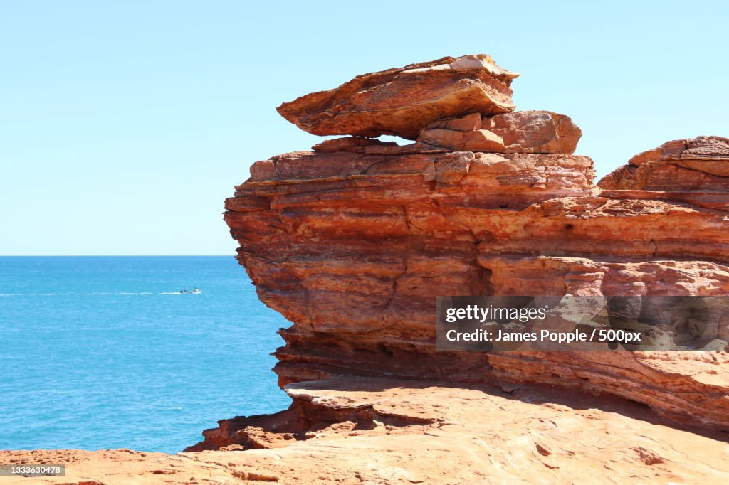 View of rock formation in sea against clear sky,Minyirr,Western Australia,Australia