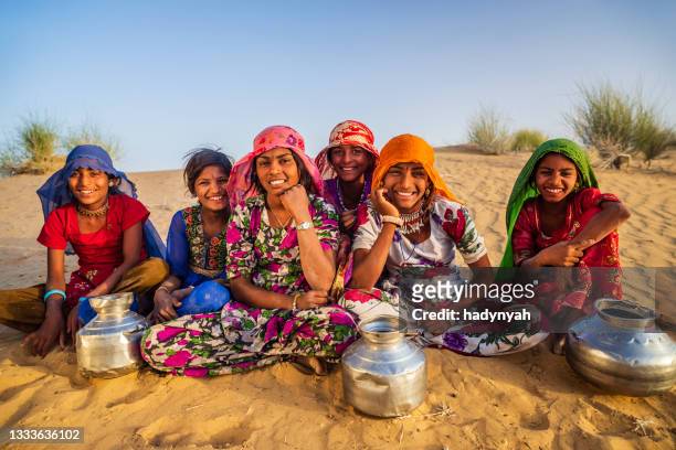indian young girls carrying water from well, desert village, india - rajasthani women stock pictures, royalty-free photos & images