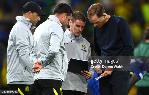 Thomas Tuchel, Manager of Chelsea discuss tactics with his coaching staff for the penalty shootout during the UEFA Super Cup 2021 match between...