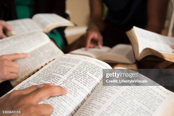 bible study.  multi ethnic group.
multi ethnic group of friends meet for a bible study.  group includes a teenager, young adults, mid-adult and senior adult. - prayer meeting stock pictures, royalty-free photos & images