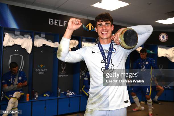 Kepa Arrizabalaga of Chelsea poses for a photo with the UEFA Super Cup Trophy in the changing room following victory in the UEFA Super Cup 2021 match...