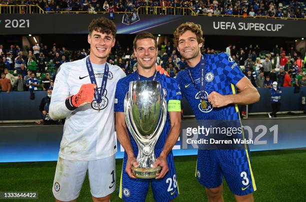 Kepa Arrizabalaga, Cesar Azpilicueta and Marcos Alonso of Chelsea pose for a photo with the UEFA Super Cup Trophy following victory in the UEFA Super...