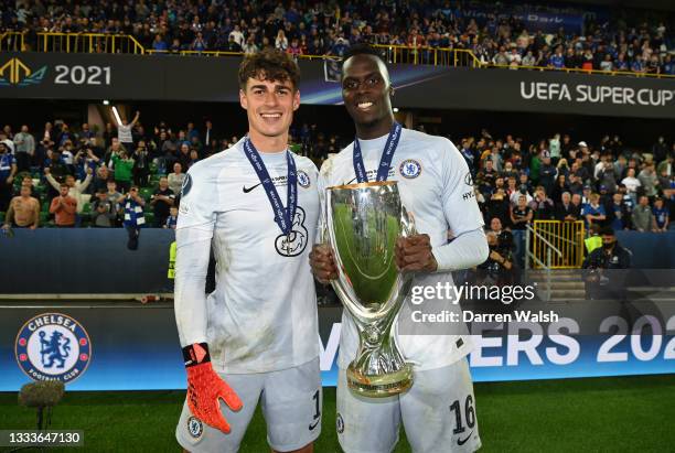 Kepa Arrizabalaga and Edouard Mendy of Chelsea celebrate with the UEFA Super Cup Trophy following victory in the UEFA Super Cup 2021 match between...