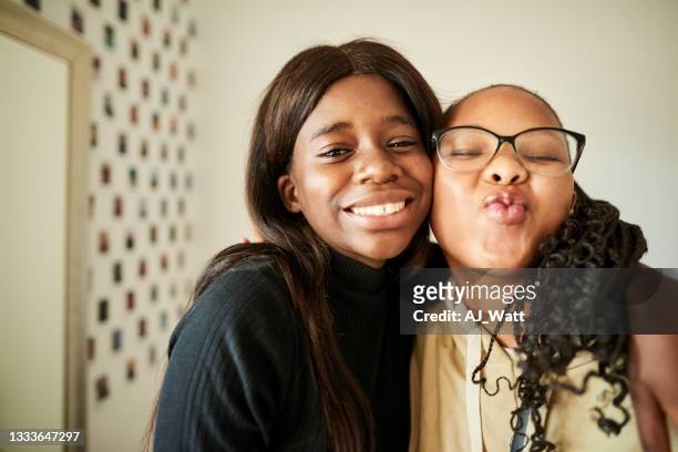 cute teenage girls at home - blowing a kiss stock pictures, royalty-free photos & images