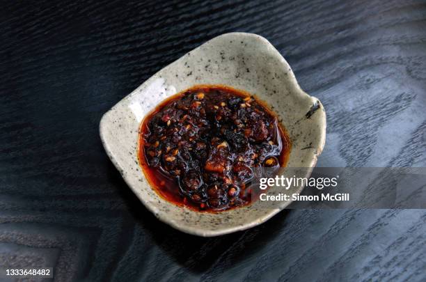salsa macha in a handmade pottery bowl - chili oil stock pictures, royalty-free photos & images