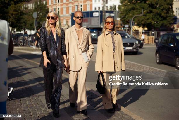 Guests outside Baum und Pferdgarten during Copenhagen fashion week SS22 on August 11, 2021 in Copenhagen, Denmark.