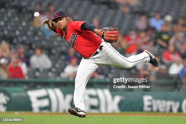 Third baseman Jose Ramirez of the Cleveland Indians bobbles a barehanded catch on a ground ball hit by Elvis Andrus of the Oakland Athletics during...