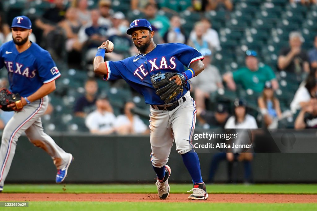 Seattle Rangers Yonny Hernandez of the Texas Rangers makes a throw to first base ...