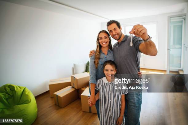 family moving into a new apartment. - computer key stock pictures, royalty-free photos & images