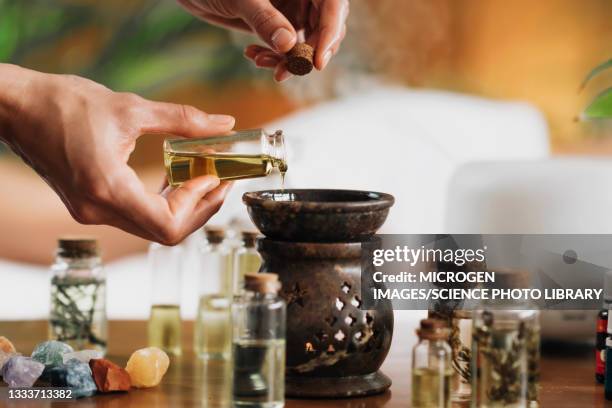 ayurveda aromatherapy with essential oil diffuser - etherische olie stockfoto's en -beelden