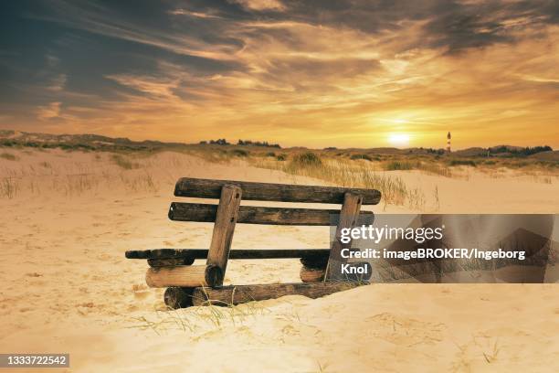 wooden bench in the dunes at sunset, amrum, schleswig-holstein, germany - insel amrum stock-fotos und bilder