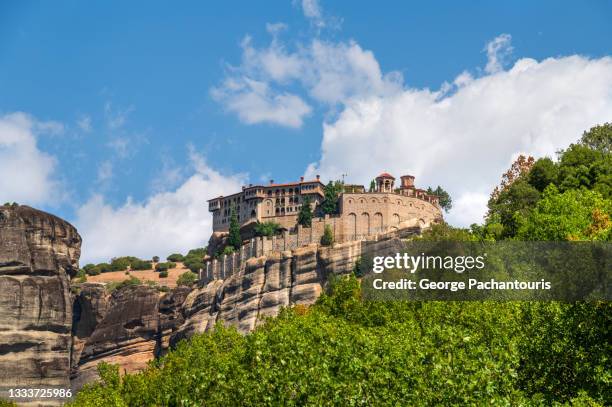 view of meteora and the varlaam monastery - meteora greece stock pictures, royalty-free photos & images